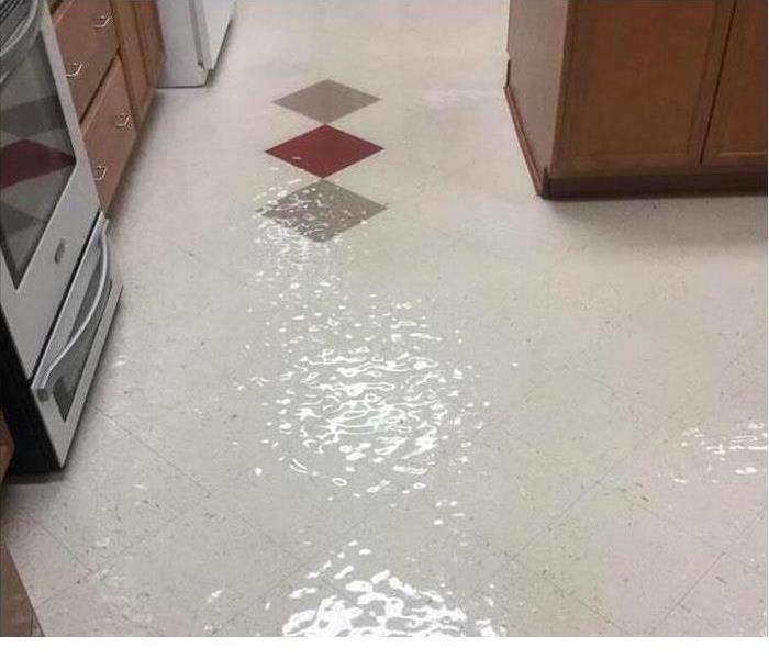 Standing water in kitchen after a bursting pipe