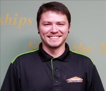 Brown haired young man in SERVPRO Attire